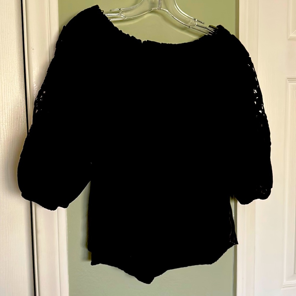 Cute linen black blouse! Cute lace detailing on elbow length sleeves!